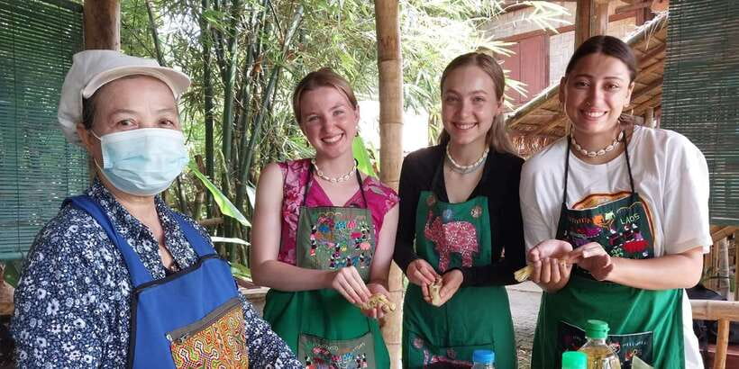 Luang Prabang: Bamboo Experience & Kuang Si Falls Tour - A calm terrace lunch and a little local entertainment