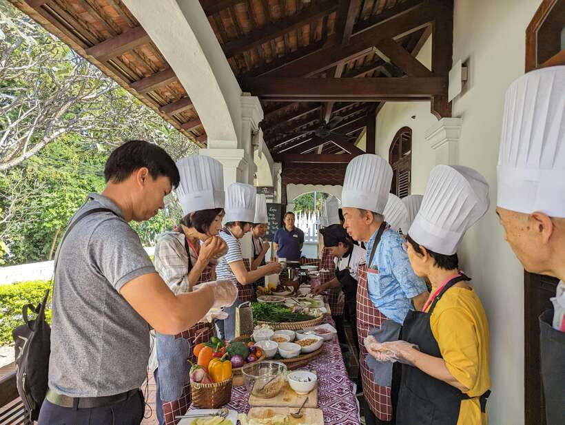 Luang Prabang: Cooking Class at the Former Royal Palace - Meeting the chef near Wat Xiengthong Temple