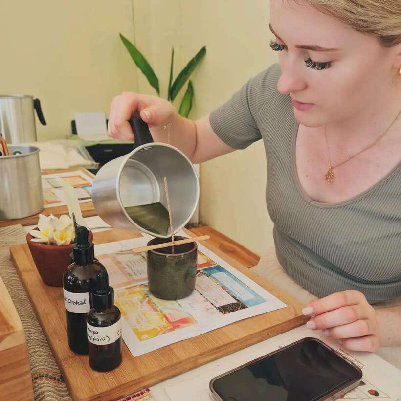 Luang Prabang: Craft Your Own Aroma Candle in Heritage Home - Pouring hot wax into local pottery