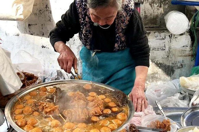Luang Prabang Evening Food Tour by Tuk-Tuk - Rice noodles, market food, and coconut pancakes