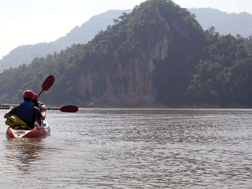 Luang Prabang: Kayak Tour to Pak Ou Caves - Hmong village life and changing tour versions