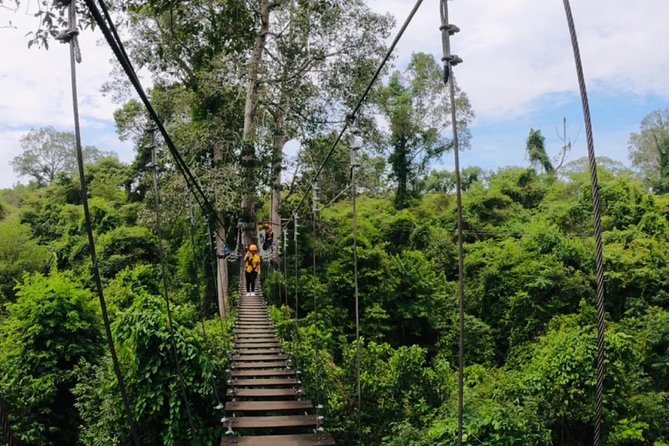 One Day Guided Tour: Kayaking, Zipline & Tubing In The Cave from Vang Vieng - Ziplining through the forest