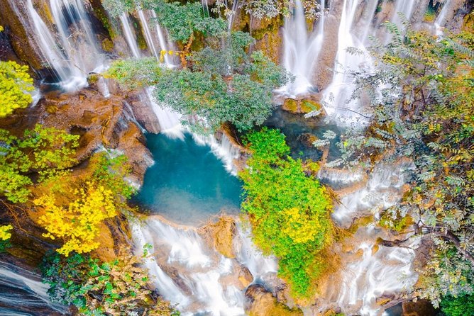 Pak Ou Caves and Kuang Si Fall Day Tour - The rural village and rice wine stop