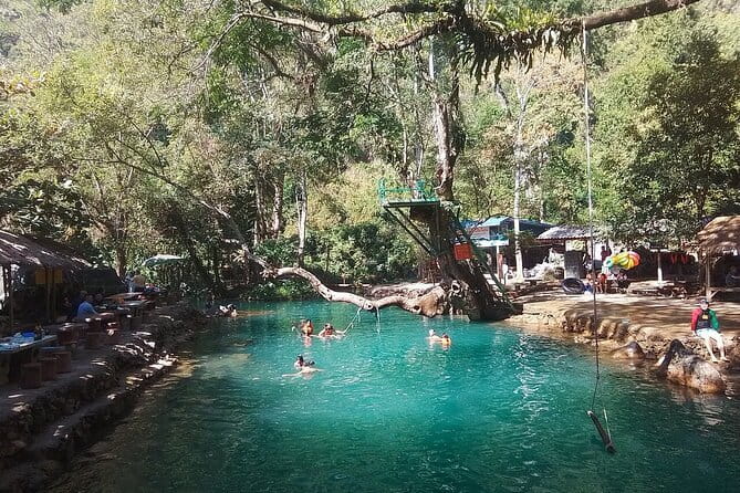 Vang Vieng Tour A Blue lagoon 3 with Caves and Zipline - Crossing the suspension bridge to the zipline